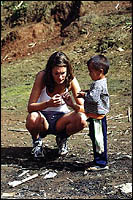 Kathryn playing with a Lahu hill tribe boy in Northern Thailand.